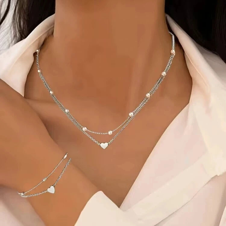 Set di gioielli con cuore di perle imitazione moda per donna Set di braccialetti con collana di perline rotonde color oro argento Set di accessori per l'uso quotidiano