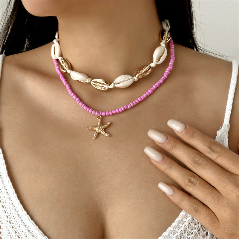Collana con ciondolo stella marina con perline di riso bohémien per donna, fatta a mano, perla d'imitazione, girocollo con perline colorate, gioielli da spiaggia estiva