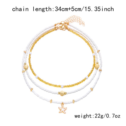 Collana con ciondolo stella marina con perline di riso bohémien per donna, fatta a mano, perla d'imitazione, girocollo con perline colorate, gioielli da spiaggia estiva