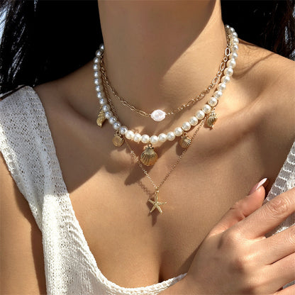 Collana con ciondolo stella marina con perline di riso bohémien per donna, fatta a mano, perla d'imitazione, girocollo con perline colorate, gioielli da spiaggia estiva