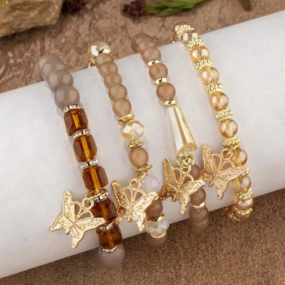 Set di braccialetti con perline a farfalla alla moda da 4 pezzi per le donne, perline acriliche rosa, braccialetto a catena elastica, regalo di gioielli per feste bohémien femminili