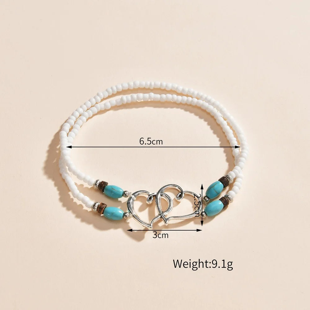 Cavigliera con perline a strati della Boemia per le donne Bracciale alla caviglia con ciondolo a doppio cuore cavo Regalo di gioielli per le vacanze estive al mare