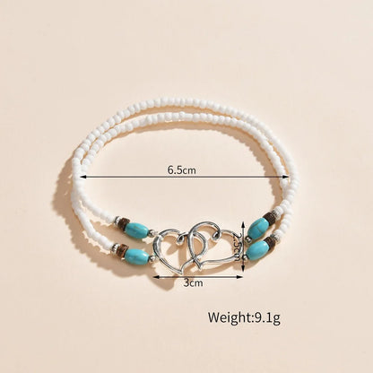 Cavigliera con perline a strati della Boemia per le donne Bracciale alla caviglia con ciondolo a doppio cuore cavo Regalo di gioielli per le vacanze estive al mare