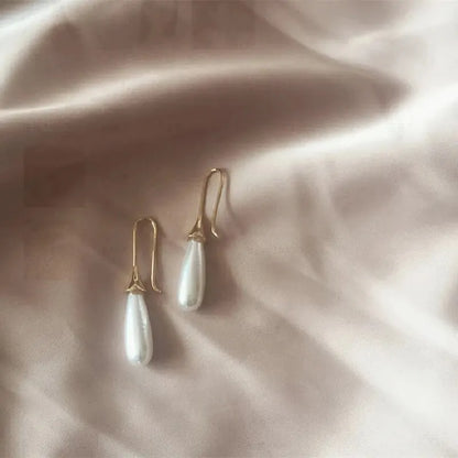 1 paio di orecchini di diamanti in vetro con perle d'imitazione d'amore in lega placcata oro di lusso leggero e vento freddo