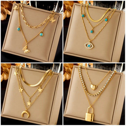 DIEYURO Collana con ciondolo occhi azzurri con serratura a forma di farfalla in acciaio inossidabile 316L per le donne Nuovi regali di gioielli con catena girocollo multistrato