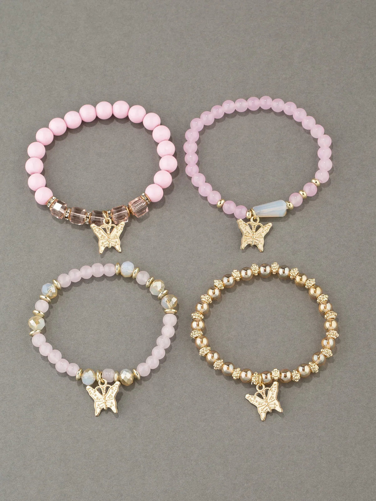 Set di braccialetti con perline a farfalla alla moda da 4 pezzi per le donne, perline acriliche rosa, braccialetto a catena elastica, regalo di gioielli per feste bohémien femminili