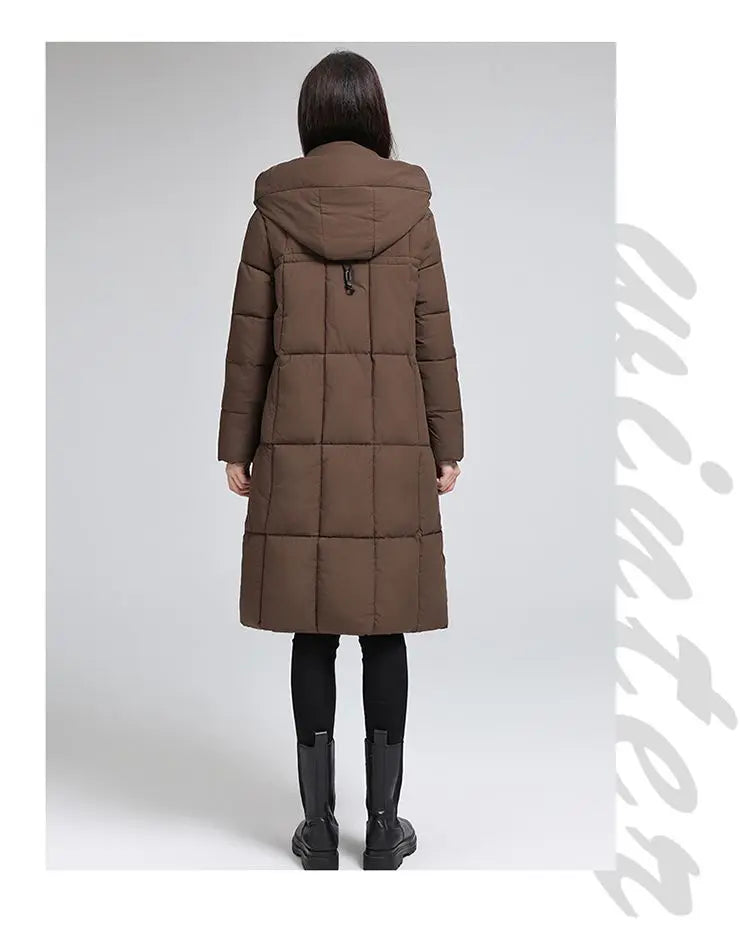 Caldo piumino in cotone da donna Inverno 2025 Nuova versione coreana Cappotto lungo con cappuccio allentato Cappotto Parka spesso antivento femminile