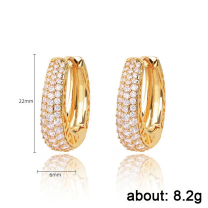 Huitan Orecchini a cerchio color oro cavo per le donne Pavimentati Abbaglianti CZ Pietra Orecchini a cerchio femminili alla moda di lusso Gioielli di dichiarazione