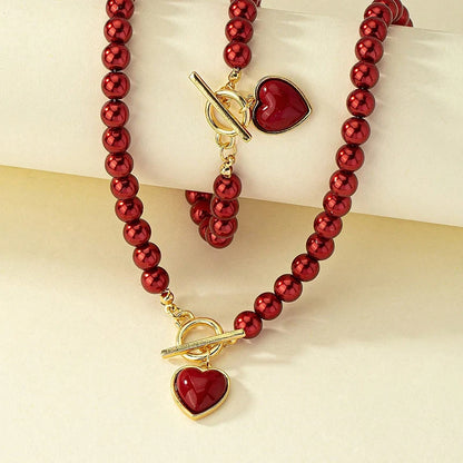 Set di gioielli con bracciale e collana di perle imitazione da 2 pezzi. Elegante collare con perline di colore naturale con ciondolo color perla per ragazza