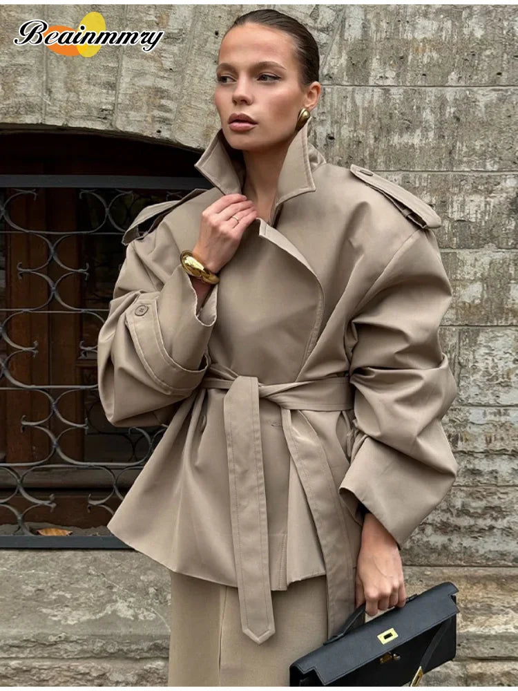 Trench con lacci con risvolto solido per le donne Moda maniche lunghe spalla larga cappotto corto allentato 2025 Nuovo autunno pendolari Outwear