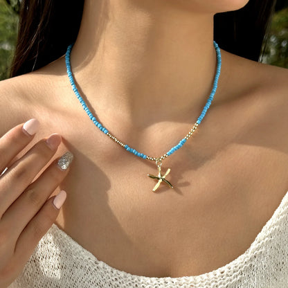 Collana con ciondolo stella marina con perline di riso bohémien per donna, fatta a mano, perla d'imitazione, girocollo con perline colorate, gioielli da spiaggia estiva