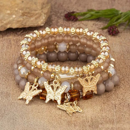 Set di braccialetti con perline a farfalla alla moda da 4 pezzi per le donne, perline acriliche rosa, braccialetto a catena elastica, regalo di gioielli per feste bohémien femminili