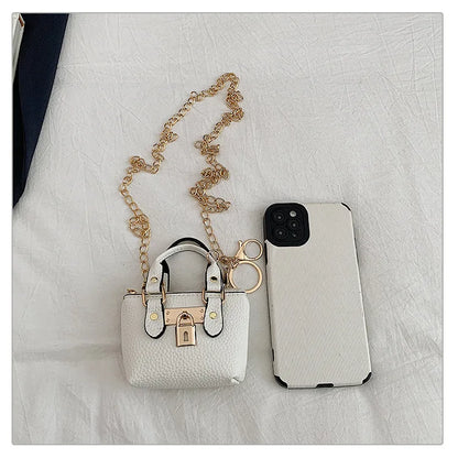 Borsa quadrata piccola da ragazza a tracolla per l'estate 2025, i nuovi bambini classici che portano una borsa a tracolla monospalla. portachiavi portafoglio
