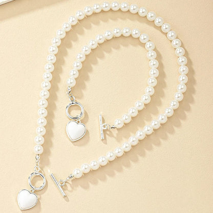 Set di gioielli con bracciale e collana di perle imitazione da 2 pezzi. Elegante collare con perline di colore naturale con ciondolo color perla per ragazza