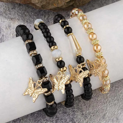 Set di braccialetti con perline a farfalla alla moda da 4 pezzi per le donne, perline acriliche rosa, braccialetto a catena elastica, regalo di gioielli per feste bohémien femminili