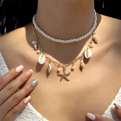 Collana con ciondolo stella marina con perline di riso bohémien per donna, fatta a mano, perla d'imitazione, girocollo con perline colorate, gioielli da spiaggia estiva