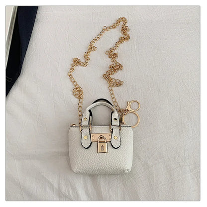 Borsa quadrata piccola da ragazza a tracolla per l'estate 2025, i nuovi bambini classici che portano una borsa a tracolla monospalla. portachiavi portafoglio