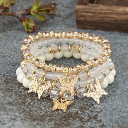 Set di braccialetti con perline a farfalla alla moda da 4 pezzi per le donne, perline acriliche rosa, braccialetto a catena elastica, regalo di gioielli per feste bohémien femminili