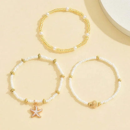 Chaîne de cheville perlée étoiles de mer coquillages style bohème d'été, ensemble à trois couches accessoire élégant pour les pieds de plage