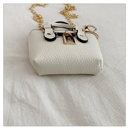 Borsa quadrata piccola da ragazza a tracolla per l'estate 2025, i nuovi bambini classici che portano una borsa a tracolla monospalla. portachiavi portafoglio