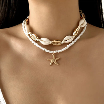 Collana con ciondolo stella marina con perline di riso bohémien per donna, fatta a mano, perla d'imitazione, girocollo con perline colorate, gioielli da spiaggia estiva