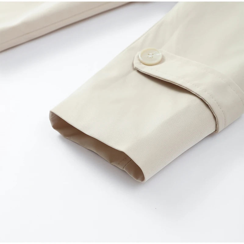 Trench con lacci con risvolto solido per le donne Moda maniche lunghe spalla larga cappotto corto allentato 2025 Nuovo autunno pendolari Outwear