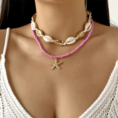 Collana con ciondolo stella marina con perline di riso bohémien per donna, fatta a mano, perla d'imitazione, girocollo con perline colorate, gioielli da spiaggia estiva