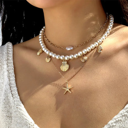 Collana con ciondolo stella marina con perline di riso bohémien per donna, fatta a mano, perla d'imitazione, girocollo con perline colorate, gioielli da spiaggia estiva