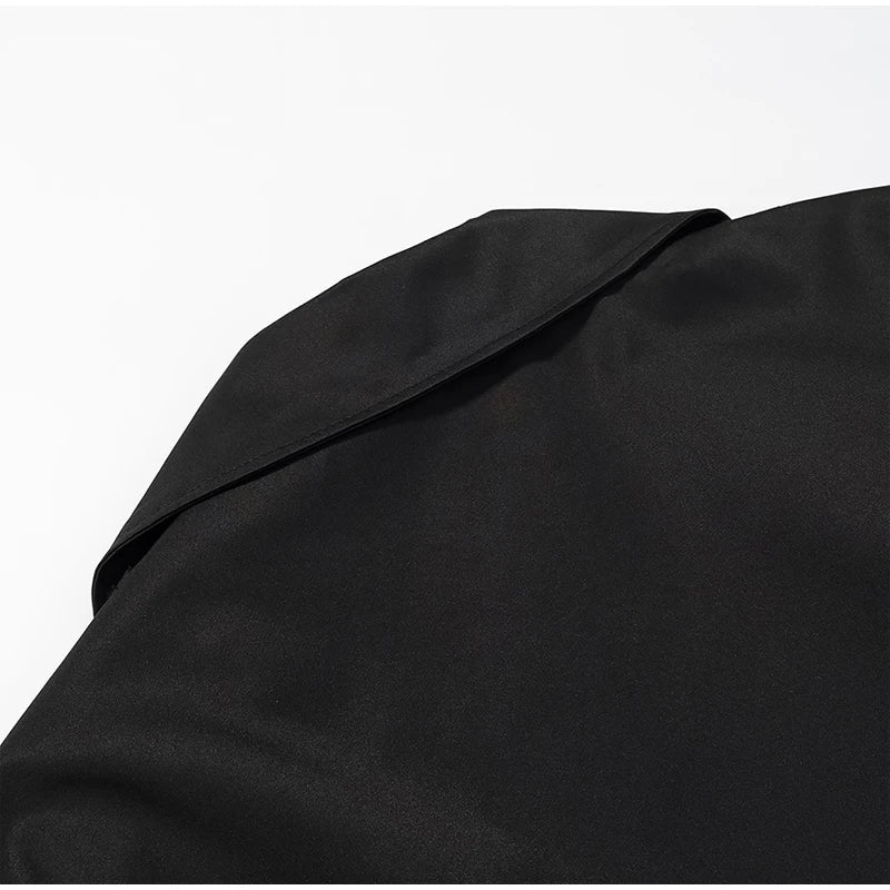 Trench con lacci con risvolto solido per le donne Moda maniche lunghe spalla larga cappotto corto allentato 2025 Nuovo autunno pendolari Outwear