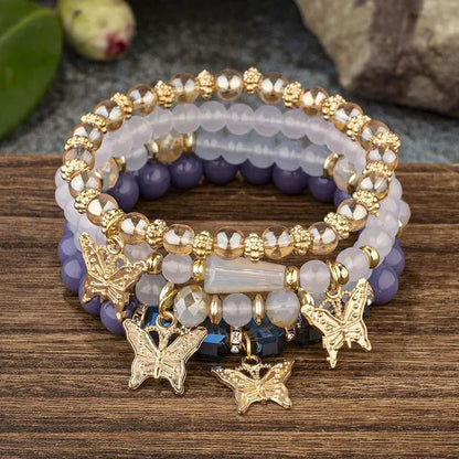 Set di braccialetti con perline a farfalla alla moda da 4 pezzi per le donne, perline acriliche rosa, braccialetto a catena elastica, regalo di gioielli per feste bohémien femminili