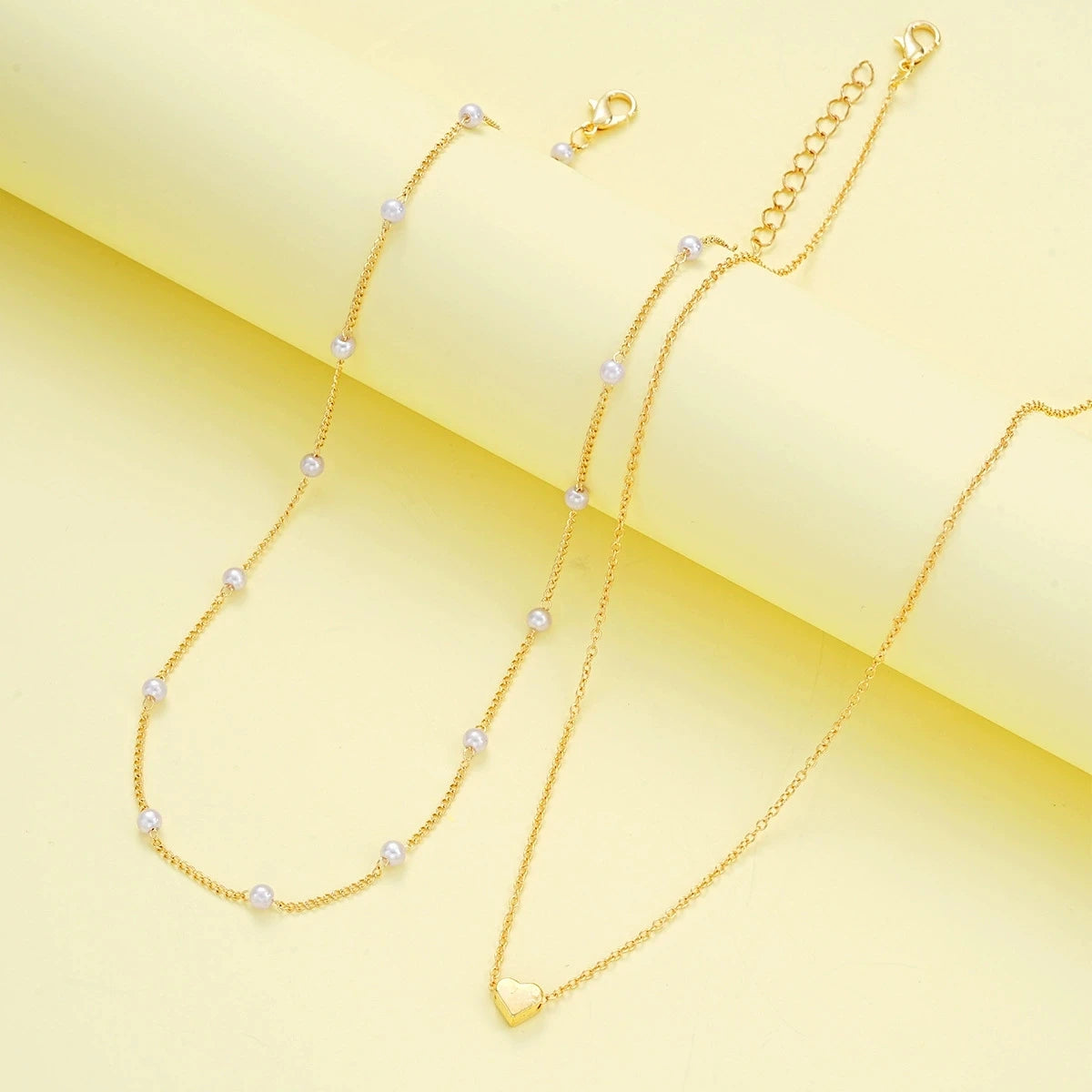 Set di gioielli con cuore di perle imitazione moda per donna Set di braccialetti con collana di perline rotonde color oro argento Set di accessori per l'uso quotidiano