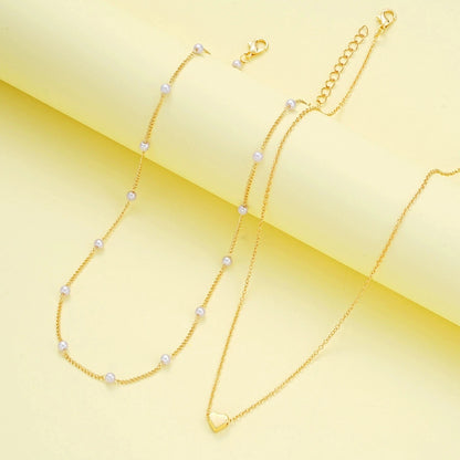 Set di gioielli con cuore di perle imitazione moda per donna Set di braccialetti con collana di perline rotonde color oro argento Set di accessori per l'uso quotidiano