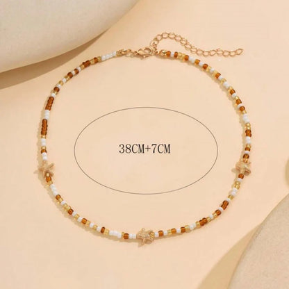 Collana con ciondolo stella marina con perline di riso bohémien per donna, fatta a mano, perla d'imitazione, girocollo con perline colorate, gioielli da spiaggia estiva