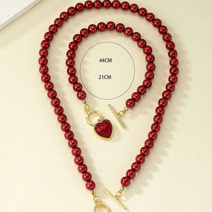 Set di gioielli con bracciale e collana di perle imitazione da 2 pezzi. Elegante collare con perline di colore naturale con ciondolo color perla per ragazza