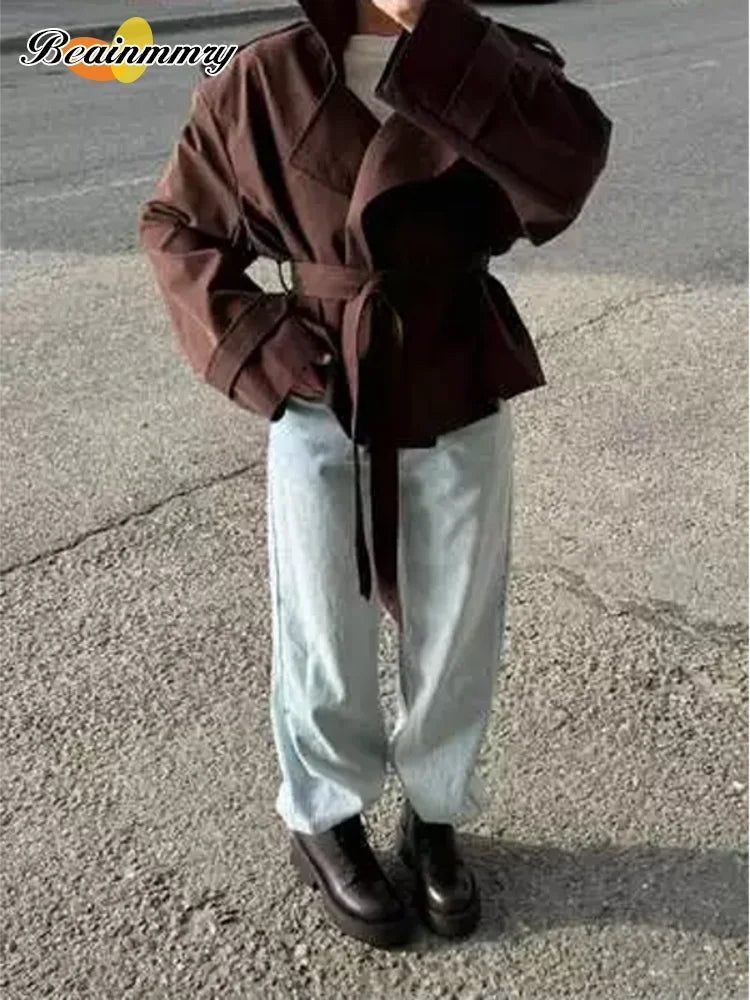 Trench con lacci con risvolto solido per le donne Moda maniche lunghe spalla larga cappotto corto allentato 2025 Nuovo autunno pendolari Outwear