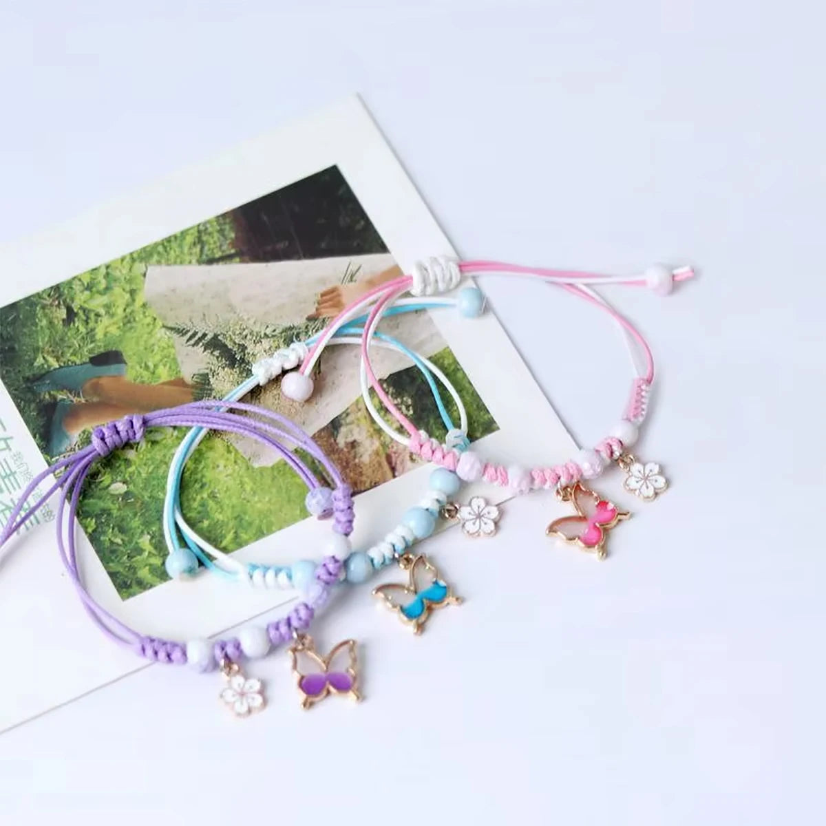 Braccialetti di fiori di farfalla della Boemia per le donne Ragazze fatti a mano viola blu rosa perline braccialetto a catena di corda intrecciata braccialetti regalo BFF