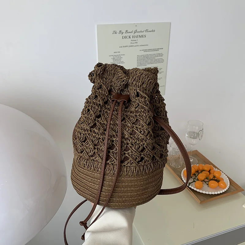 Borsa a tracolla da spiaggia in paglia estiva da donna fatta a mano borsa a tracolla con coulisse cava intrecciata borsa da viaggio con Design femminile di moda lavorata a maglia