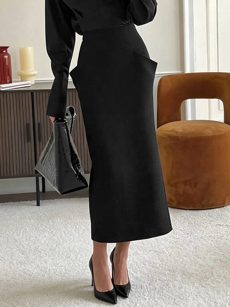 Gonna midi a vita alta stampata, con incrocio frontale e taglio dritto, collezione autunno 2026, gonna da donna per uso quotidiano, alla moda, elegante e casual.