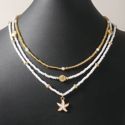 Girocollo impilato con perline fatte a mano bohémien, delicato collana con ciondolo a conchiglia di stelle marine, gioielli da donna per feste estive in spiaggia