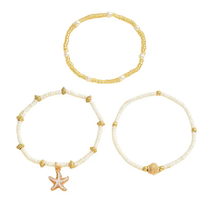 Chaîne de cheville perlée étoiles de mer coquillages style bohème d'été, ensemble à trois couches accessoire élégant pour les pieds de plage
