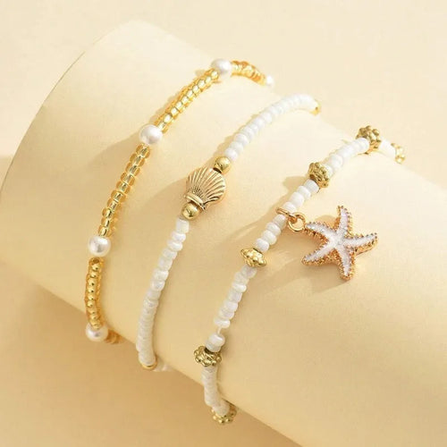 Chaîne de cheville perlée étoiles de mer coquillages style bohème d'été, ensemble à trois couches accessoire élégant pour les pieds de plage