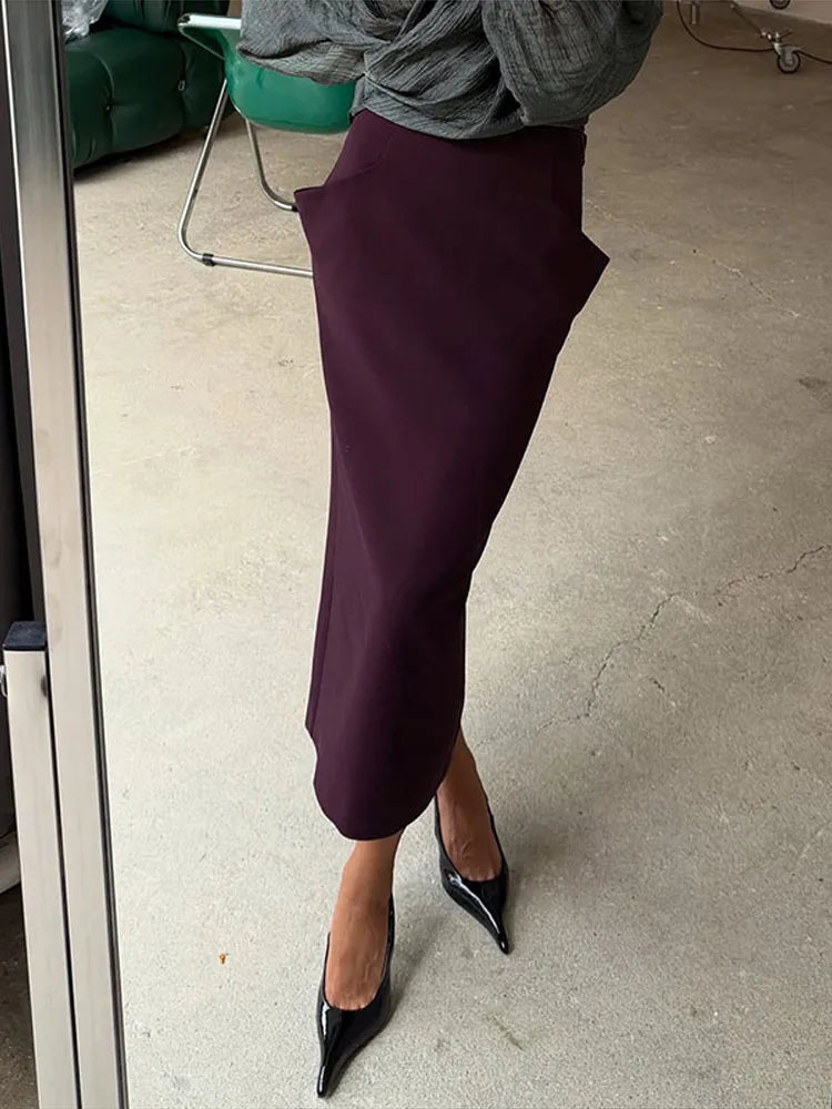 Gonna midi a vita alta stampata, con incrocio frontale e taglio dritto, collezione autunno 2026, gonna da donna per uso quotidiano, alla moda, elegante e casual.