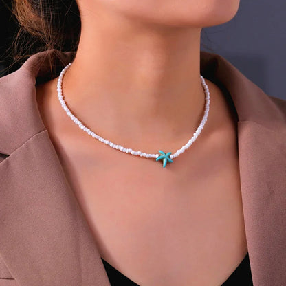 Collana con ciondolo stella marina con perline di riso bohémien per donna, fatta a mano, perla d'imitazione, girocollo con perline colorate, gioielli da spiaggia estiva